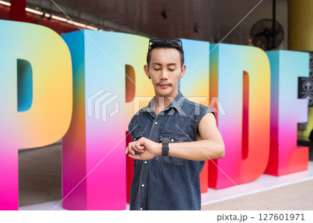 Portrait of confident non binary gay man during pride outdoors 127601971