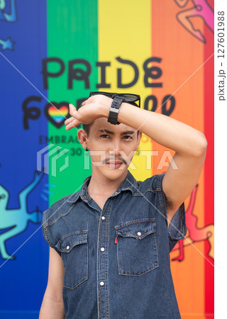 Portrait of confident non binary gay man during pride outdoors 127601988