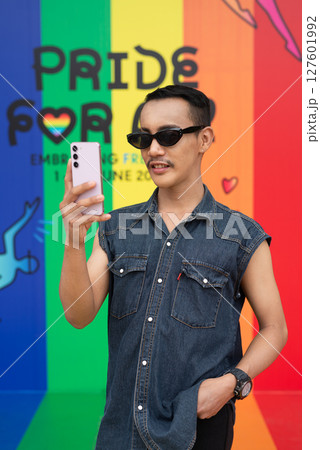 Portrait of confident non binary gay man during pride outdoors 127601992