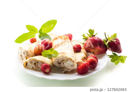 Ukrainian pancakes with cottage cheese in a white plate Ukrainian pancakes with cottage cheese in a white plate 127602065