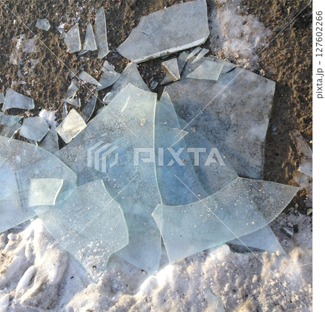 Crushed pieces of ice on asphalt. Crushed pieces of ice on asphalt. 127602266