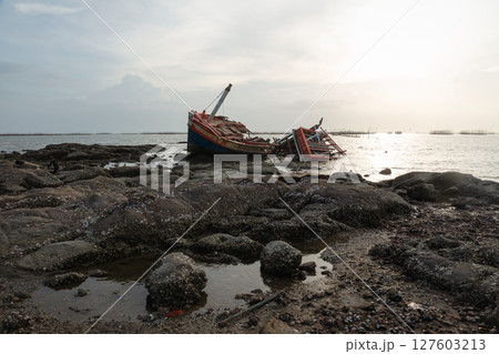 Old wrecked fishing boat on coast of Ang Sila Village, Saensuk Sub-district, Chonburi Province of thailand. Old wrecked fishing boat on coast of Ang Sila Village, Saensuk Sub-district, Chonburi Province of thailand. 127603213
