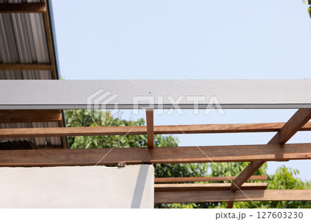 Roof under construction with sky background. Roof under construction with sky background. 127603230