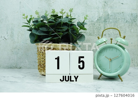 Wooden Calendar Showing the Date of July 15th. Day 15 of July month 127604016
