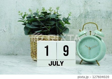 Wooden Calendar Showing the Date of July 19th. Day 19 of July month 127604020