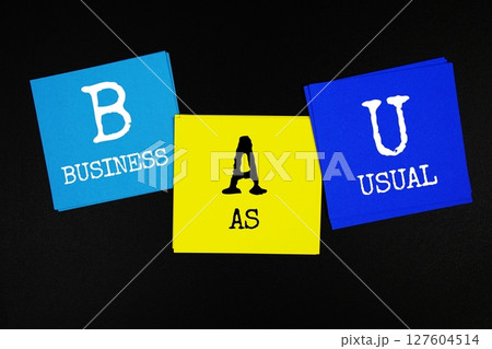 BAU - Business as Usual acronym text on sticky note on black background BAU - Business as Usual acronym text on sticky note on black background 127604514