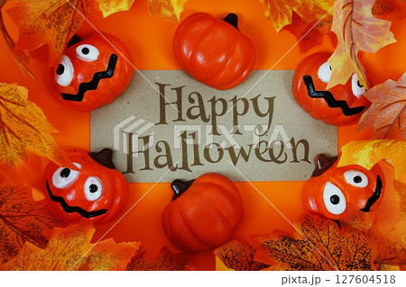 Happy Halloween text with element decorations on orange background Happy Halloween text with element decorations on orange background 127604518
