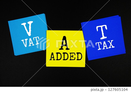 VAT - Value Added Tax acronym text on sticky note on black background 127605104