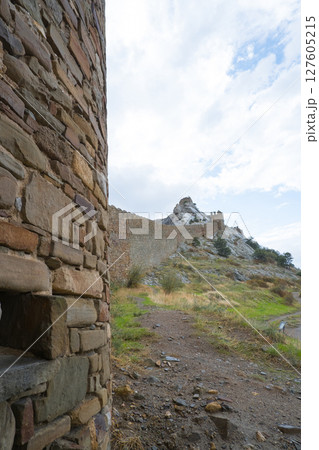 Sudak fortress. Old Genoese fortress in the city of Sudak in summer. Ancient architecture of Crimea Sudak fortress. Old Genoese fortress in the city of Sudak in summer. Ancient architecture of Crimea 127605215