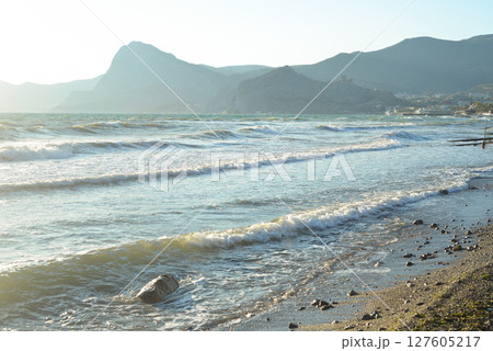 Background landscape view of Sudak Bay, the city of Sudak and its embankment in Crimea. 127605217