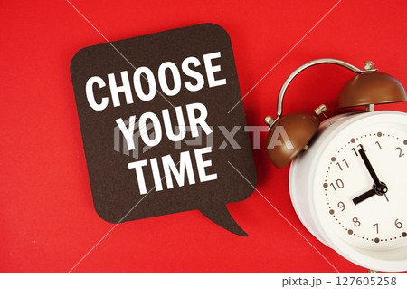 Choose Your Time text on speech bubble with alarm clock on red background 127605258