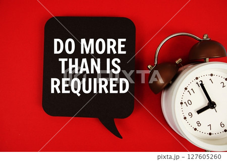 Do More Than Is Required text on speech bubble with alarm clock on red background Do More Than Is Required text on speech bubble with alarm clock on red background 127605260