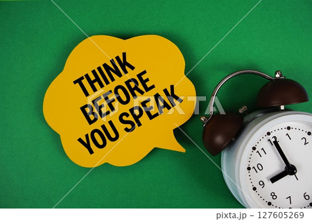 Think Before You Speak text on speech bubble with alarm clock on green background Think Before You Speak text on speech bubble with alarm clock on green background 127605269