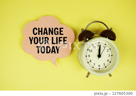 Change Your Life Today text on speech bubble with alarm clock on yellow background 127605300