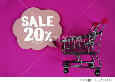 Sale 20% text with speech bubble and trolley shopping cart on pink background Sale 20% text with speech bubble and trolley shopping cart on pink background 127605311