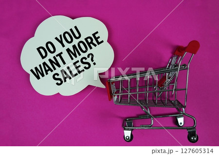 Do You Want More Sales text with speech bubble and trolley shopping cart on pink background 127605314