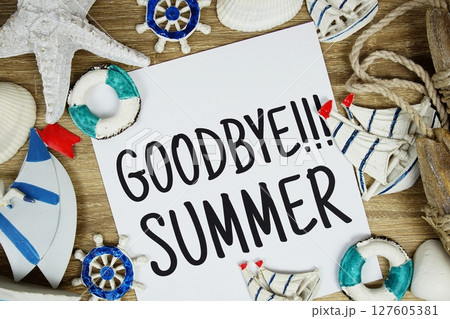 Goodbye Summer text on paper card with marine items decorative top view 127605381