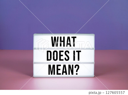 What Does It Mean? text on LED lightbox on purple and pink geometric background What Does It Mean? text on LED lightbox on purple and pink geometric background 127605557