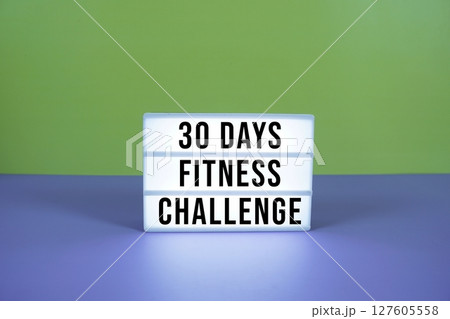 30 Days Fitness Challenge text on LED lightbox on purple and green geometric background 30 Days Fitness Challenge text on LED lightbox on purple and green geometric background 127605558