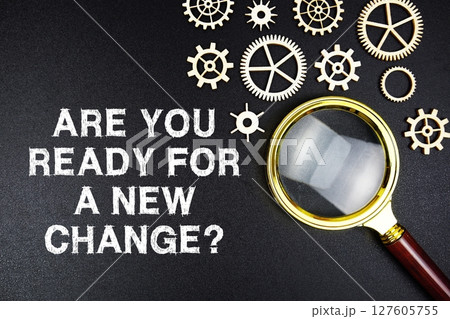 Are You Ready For A New Change? text message with magnifying glass on black background 127605755