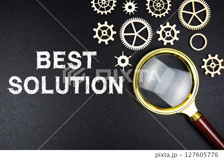 Best Solution text message with magnifying glass on black background Best Solution text message with magnifying glass on black background 127605776