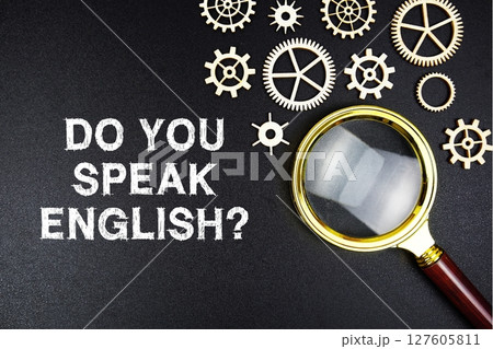 Do You Speak English? text message with magnifying glass on black background 127605811