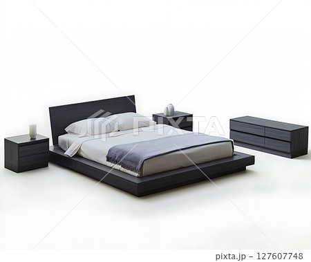 A black bed with a blue blanket and white pillows A black bed with a blue blanket and white pillows 127607748