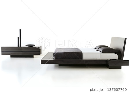 A bed with a black and white striped comforter A bed with a black and white striped comforter 127607760