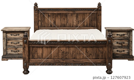 A wooden bed with a white pillow sits next to a wooden nightstand 127607923