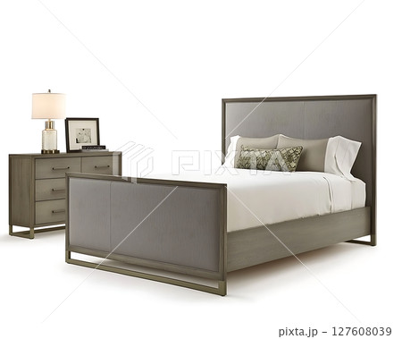 A bed with a pillow and a lamp on a table 127608039