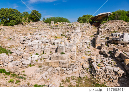 Ruins of the South Gate of ancient Troy in Canakkale Turkey with layered stone walls and archaeological excavation 127608614