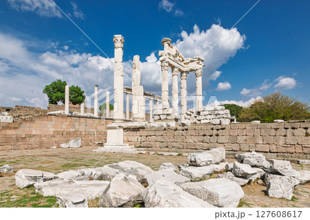 Wide view of Temple of Trajan ruins on Pergamon acropolis with standing marble columns and dramatic spring sky in Turkey Wide view of Temple of Trajan ruins on Pergamon acropolis with standing marble columns and dramatic spring sky in Turkey 127608617