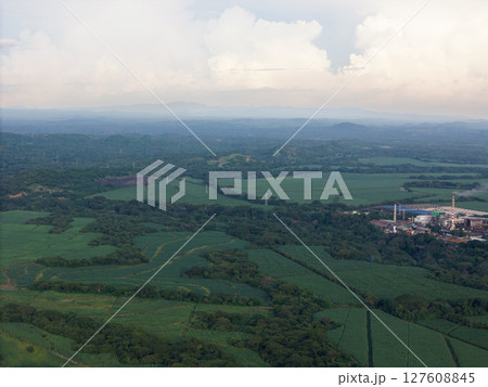 Green farmland with big factory Green farmland with big factory 127608845