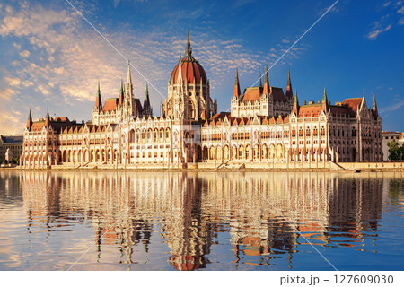 Parliament of Hungary building reflecting in Danube River at sunrise in Budapest Parliament of Hungary building reflecting in Danube River at sunrise in Budapest 127609030