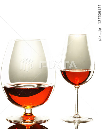 Port wine glass, petite sophisticated design, spiral liquid motion, studio lighting, professional product photography 127609125