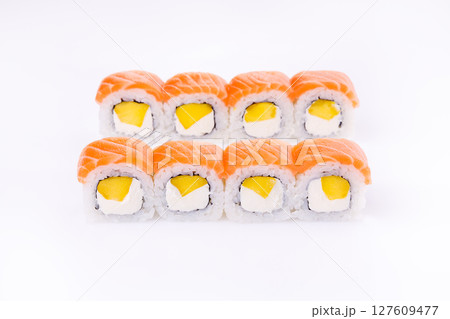 Creamy Mango and Salmon Topped Philadelphia Roll on White Background 127609477
