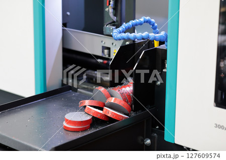 steel rod cutting by industrial band saw machine steel rod cutting by industrial band saw machine 127609574
