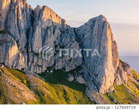 Drone view of Bolshoy Tkhach dolomites mount in Caucasus with sunset or sunrise light Drone view of Bolshoy Tkhach dolomites mount in Caucasus with sunset or sunrise light 127609719