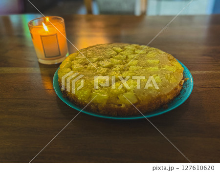 Homemade pineapple upside down pie with candied cherries . Tropical dessert on white background 127610620