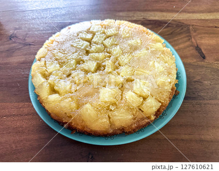 Homemade pineapple upside down pie with candied cherries . Tropical dessert on white background 127610621