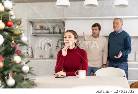 Two men quarreling with young woman Two men quarreling with young woman 127612332