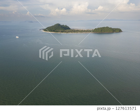 Aerial view of serene exotic aerial view above Thailand coastline and sandy beach, featuring a beautiful bay and coastal cliffs. Tropical natural beauty on the coastline creating an exotic landscape. Aerial view of serene exotic aerial view above Thailand coastline and sandy beach, featuring a beautiful bay and coastal cliffs. Tropical natural beauty on the coastline creating an exotic landscape. 127613571