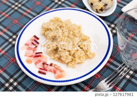 Oatmeal served with lard on plate Oatmeal served with lard on plate 127617981