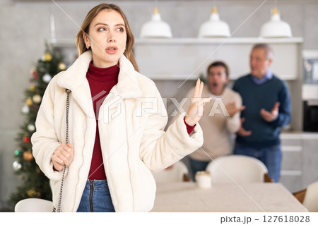 Men quarreling with girl 127618028