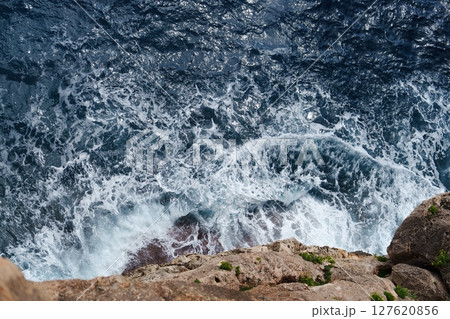 Majestic Ocean Waves Crashing Against Rocky Cliffs A Stunning Coastal Landscape View Majestic Ocean Waves Crashing Against Rocky Cliffs A Stunning Coastal Landscape View 127620856
