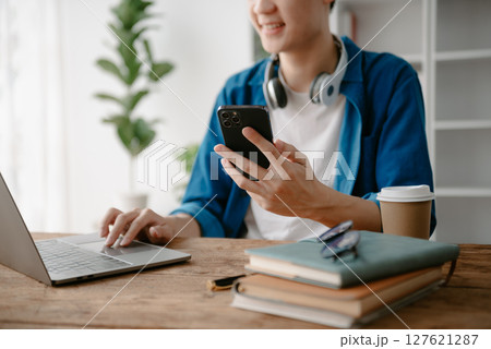 Man hands using smartphone and holding credit card sitting. Online Shopping payments  concept. 127621287