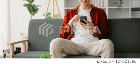 Man hands using smartphone and holding credit card sitting. Online Shopping payments  concept. 127621366