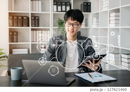 Digital marketing media in virtual screen.businesswoman hand working with mobile phone and modern compute with VR icon diagram at office 127621400