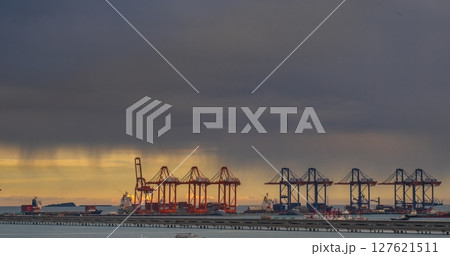 Logistic shipping quay boat Engineering crane depot at logistic export terminal control. Warehouse freight background container yard loading quayside harbor port. Logistics seascape shipping portal 127621511