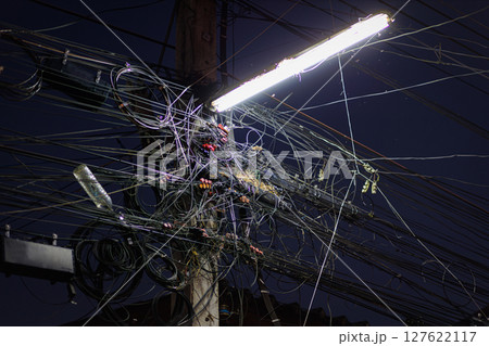 Chaos of cables and wires on an electric pole. Many electrical cable - wire and telephone line on electricity post, Thailand, Chaos of cables and wires on an electric pole. Many electrical cable - wire and telephone line on electricity post, Thailand, 127622117